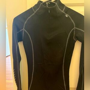 Helly Hansen black long sleeve performance top. Size Small